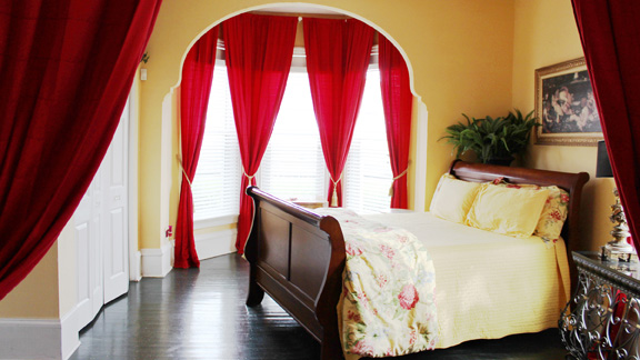Large high archways leading to bedroom
